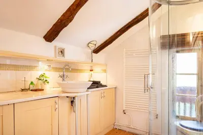 a bathroom with a sink and a shower at Holiday Home Katric in Kamno