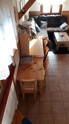a living room filled with furniture and a couch at Tourist Farm Znidarjevi in Kožljek