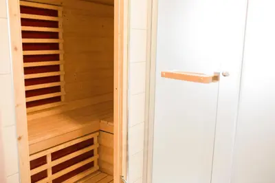 a sauna is shown with a glass door at Apartments Beeland Skok in Mozirje