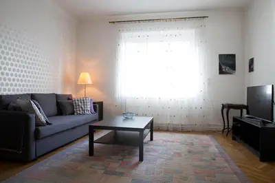 a living room with a couch and a coffee table at Tomas's apartment in Ljubljana