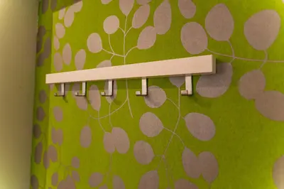 a towel rack with a green and brown pattern at Tomas's apartment in Ljubljana