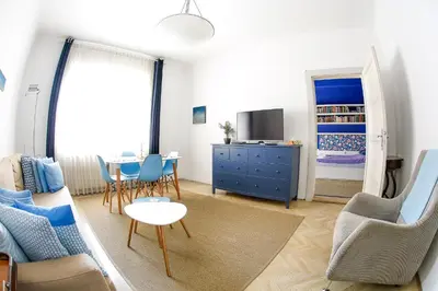 a living room with a couch and a table at Taya apartment in Ljubljana