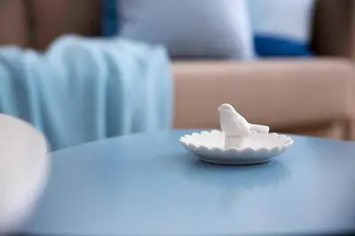 a bowl of whipped cream sitting on a table at Taya apartment in Ljubljana