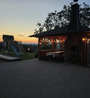 a playground with a pavilion and a slide at Adventure Farm in Štore