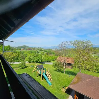 a view of a yard with a playground at Adventure Farm in Štore