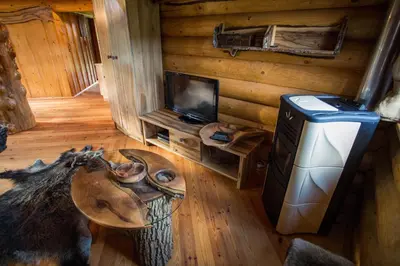 an overhead view of a living room in a log cabin at Village Cottage - Koča na vasi in Nazarje