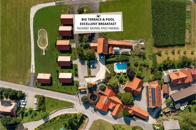 arial view of a house with a sign that reads bus transfer room boston at Martinova izba - Rooms & Apartments in Laško