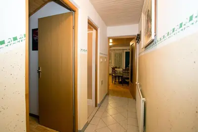 a hallway with a door leading to a room at Zeleni apartma Zreče in Zreče