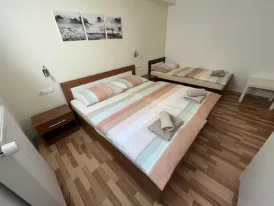 a bedroom with a bed with two towels on it at Apartma Slivnik in Spodnje Gorje