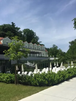 a row of lounge chairs in front of a building at Apartment on Zdraviliski trg 7 in Rogaška Slatina