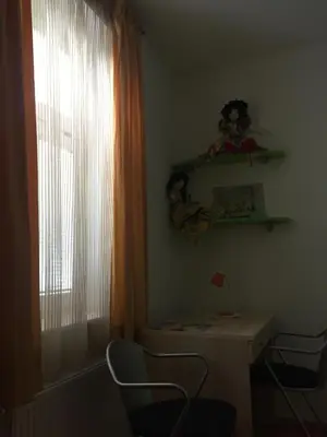a room with a table and chairs and a window at Apartment on Zdraviliski trg 7 in Rogaška Slatina