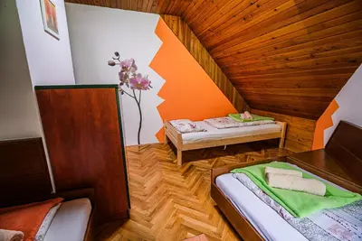 a room with two beds in a room at Holiday Home Vila Kopriva in Gozd Martuljek