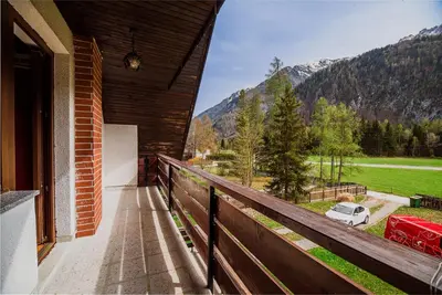 a balcony of a house with a view of a mountain at Holiday Home Vila Kopriva in Gozd Martuljek