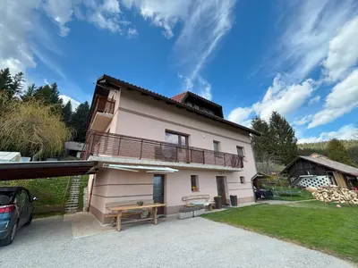 a house with a balcony on the side of it at Apartment Panorama in Zreče