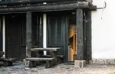 a window of a building with a bench in it at Apartments Rogla in Zreče