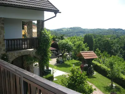 a balcony of a house with a view of a yard at Hiša Koražija in Rogaška Slatina
