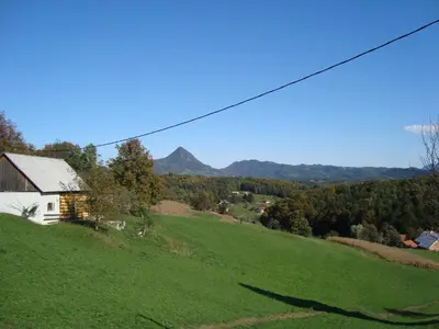 a house on a hill with a green field at Hiša Koražija in Rogaška Slatina