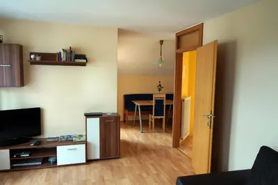 a living room with a room with a table and a door at Tourist farm Samec in Sele