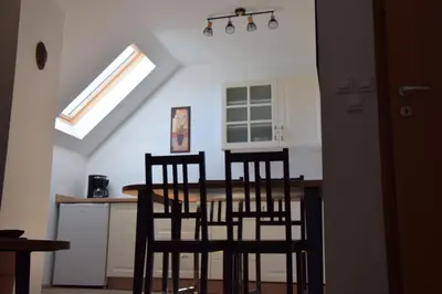 a kitchen with a table and chairs in a room at Tourist farm Samec in Sele