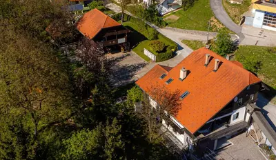 an overhead view of a house with an orange roof at Resort pod orehi - Bled - Apartma & Glamping & Savna in Bled