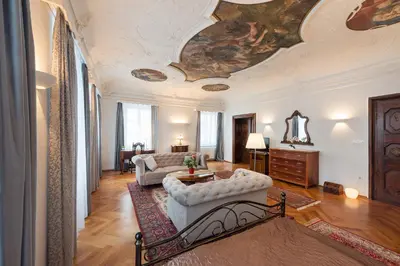 a living room with a ceiling with a painting on it at Codelli Deluxe Fresco City Centre APP With Balcony in Ljubljana