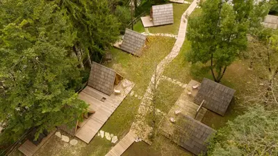 an overhead view of a group of houses in a garden at Camp Korita in Soča