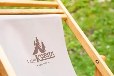 a sign for a camp kuth sign on a table at Camp Korita in Soča