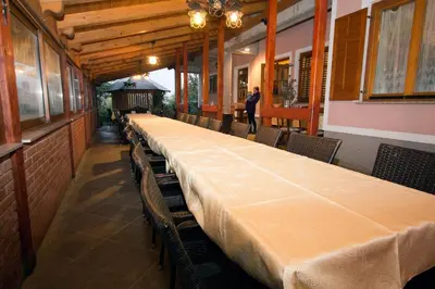 a long dining room with a long table and chairs at Tourist Farm Gregorič in Zalošče