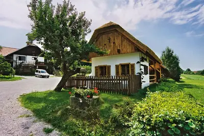 a small wooden house with a fence in front of it at Tourist Farm Ferencovi in Cankova
