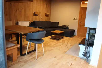 a living room with a couch and a table at Apartment Appohorje in Pohorje