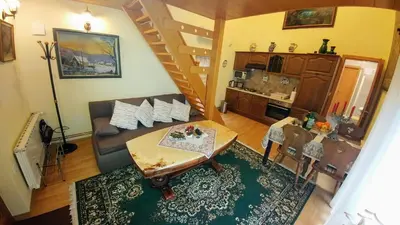 a living room with a couch and a table at Apartments Ina in Rogaška Slatina