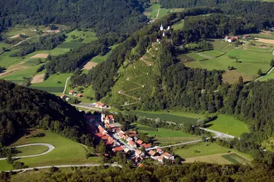 an aerial view of a village on a mountain at Apartments Kozjanski park in Podsreda