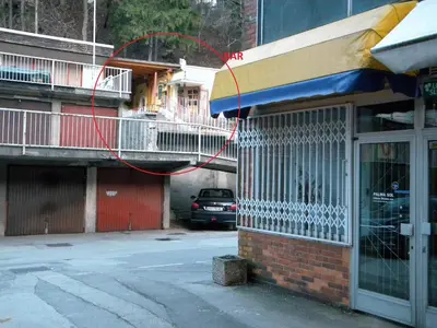 a red cord hanging from the side of a building at Studio Jesenice in Jesenice