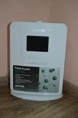 a washing machine sitting on top of a wooden floor at Apartment Kancler in Nova Gorica