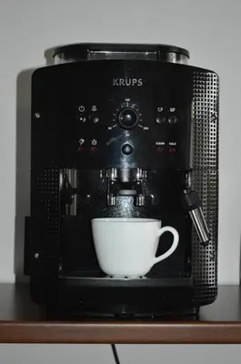 a coffee maker with a cup of coffee at Apartment Kancler in Nova Gorica