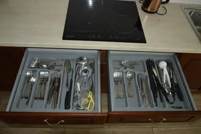 a drawer with utensils in it on a kitchen counter at Apartment Kancler in Nova Gorica