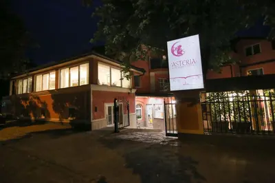a building with a sign on the side of it at Boutique Hotel Asteria in Ljubljana