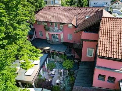 an overhead view of a building with pink at Boutique Hotel Asteria in Ljubljana