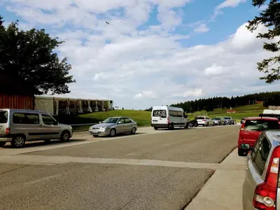 a busy highway with cars parked on the side at Apartma David Rogla in Zreče