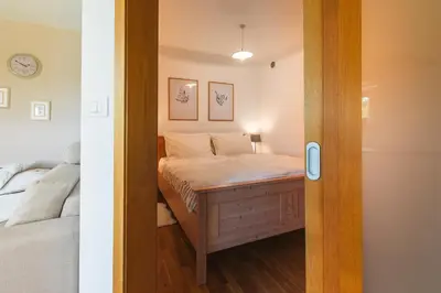 a small bedroom with a bed in a room at Na Kupčku Estate 