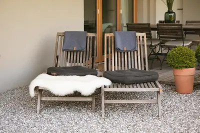 a couple of chairs with cushions on top of them at Na Kupčku Estate 
