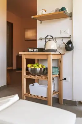 a table with a bowl of fruit in a kitchen at Na Kupčku Estate 