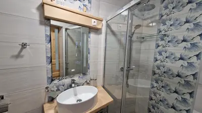 a bathroom with a sink and a shower at Tourist farm Gričnik in Resnik