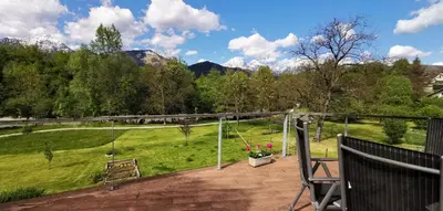 a balcony with a view of a field at 7th Mill apartments in Kranj