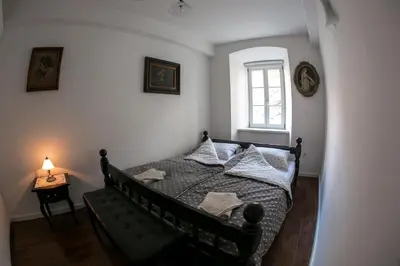 a bedroom with a bed and a window at 3 Bridges App in Ljubljana