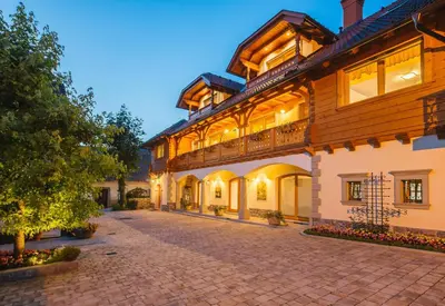 a large building with a cobblestone street at Apartment Ledrar in Bled
