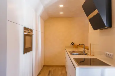 a kitchen with a sink and a counter top at Apartment Ledrar in Bled