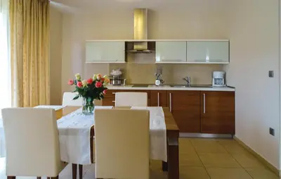 a kitchen and dining room with a table and chairs at Beautiful Apartment In Lasko With Wifi in Laško