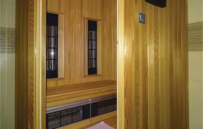 a room with two windows in a room at Beautiful Apartment In Lasko With Wifi in Laško