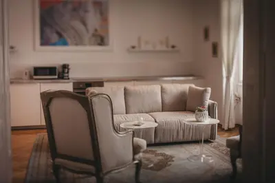 a living room with a couch and a table at AB Ljubljana - Prince Filip Apartment in Ljubljana